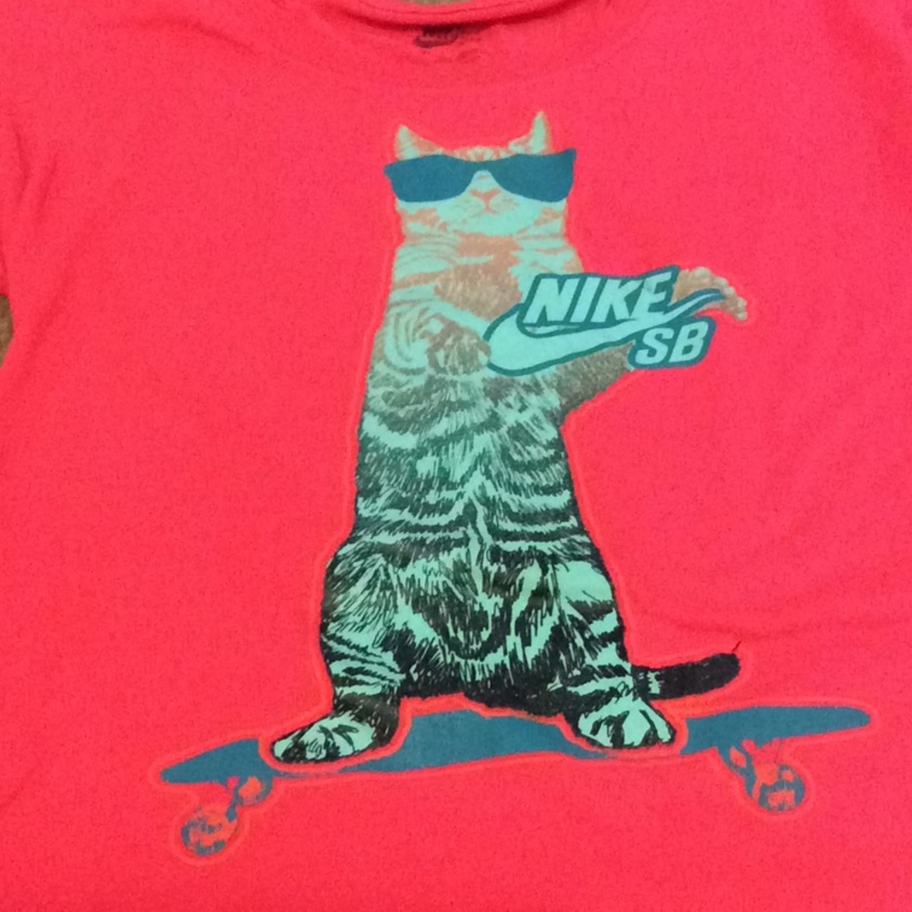 A Nike shirt with a cat